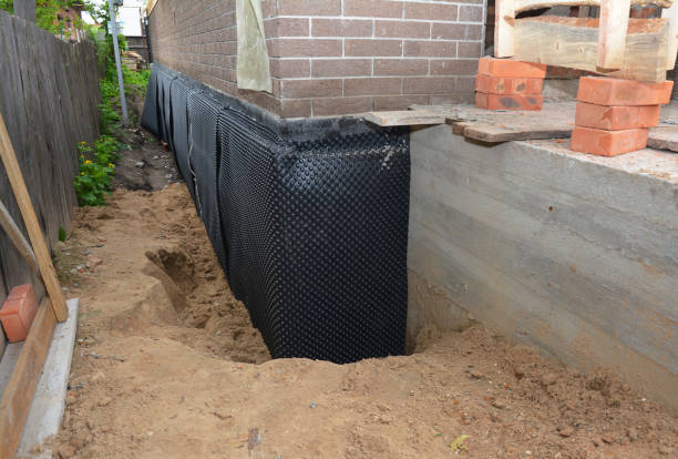 Happy homeowners after waterproofing job in East Greenville